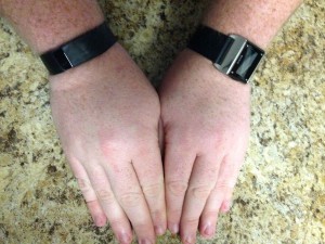 Wearing two fitness trackers at once, the 2014 Carbon Steel Basis on my left wrist, the Fitbit Force on my right.