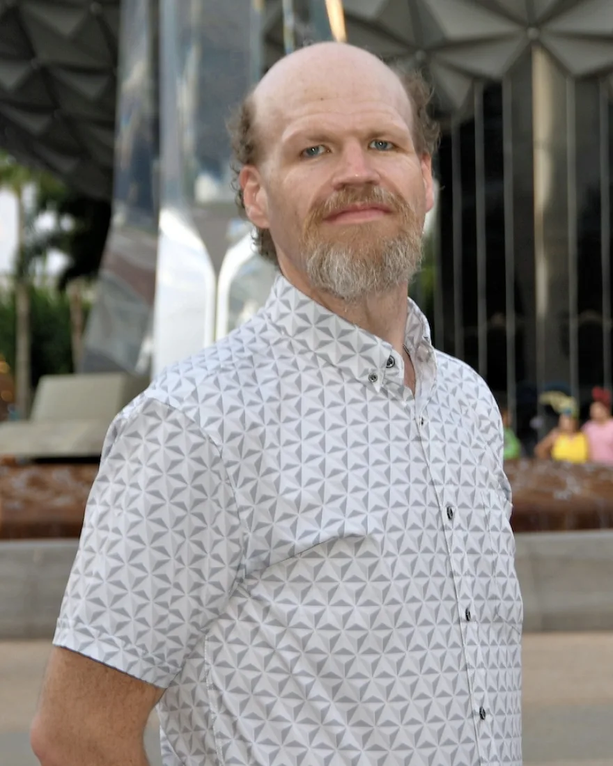 Jon Westfall outdoors in a white patterned shirt